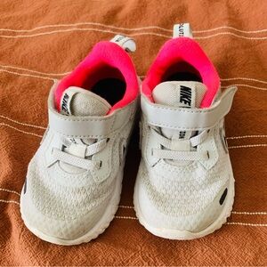 Gray and pink baby Nike shoes